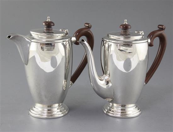 A 1940s silver cafe au lait pair by Mappin & Webb, gross 30.5 oz.